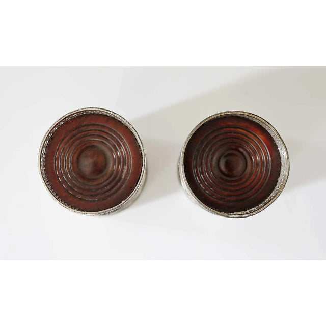 Set of eight, antique silver on copper wine bottle coaster with a reticulated, pierced design and a wood base. Similar...