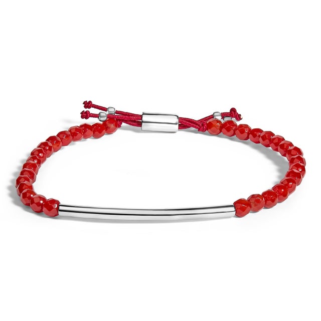 Immerse in the earthy allure of vibrant red jasper, each bead meticulously threaded along a lustrous .925 sterling silver...