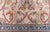 This antique-style Bessarabian carpet (size adjusted) unfolds on a softly mottled cream-beige ground, its surface alive...