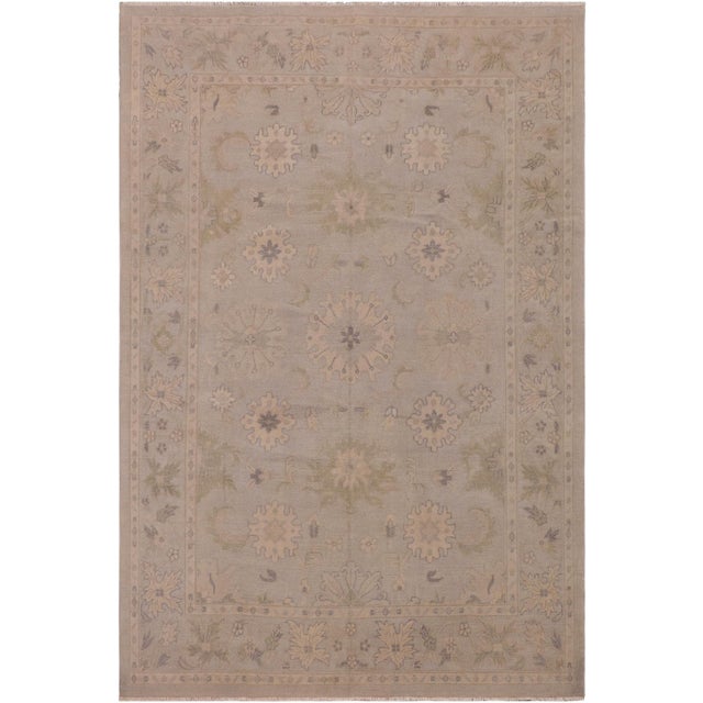 A Persian influenced Turkish hand knotted rug made by skilled artisans capable of creating the most exceptional vegetable...
