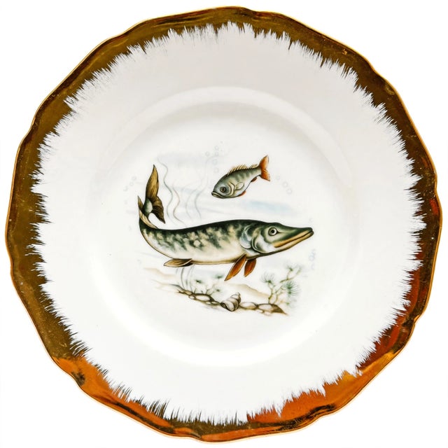 Elevate your next coastal or lakeside gathering with this 7-piece vintage porcelain fish service set. Sourced from an...