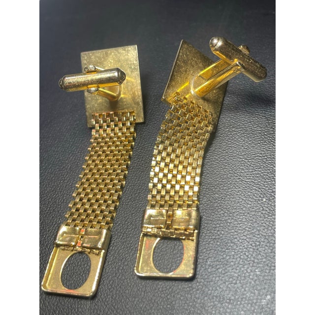 Bakelite rich amber cameos with art deco style frosted and polished geometric lines, finished with flowing articulating...