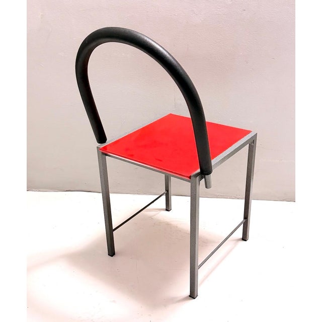 Made in Italy, 1980s. It features a laminate seating, a rubber backseat and a varnished metal frame. Its style recalls...