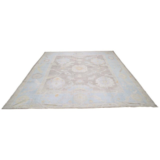 Turkish hand woven Oushak rug with allover design and silky soft texture.