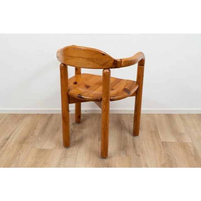 Wooden dining chair with armrests by Rainer Daumiller for Hirtshals Savværk. The chair is made out of pine wood. I have...