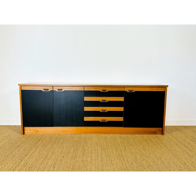 Vintage Scandinavian sideboard dating from the 1970s, featuring three storage doors with shelves and four drawers. Doors...