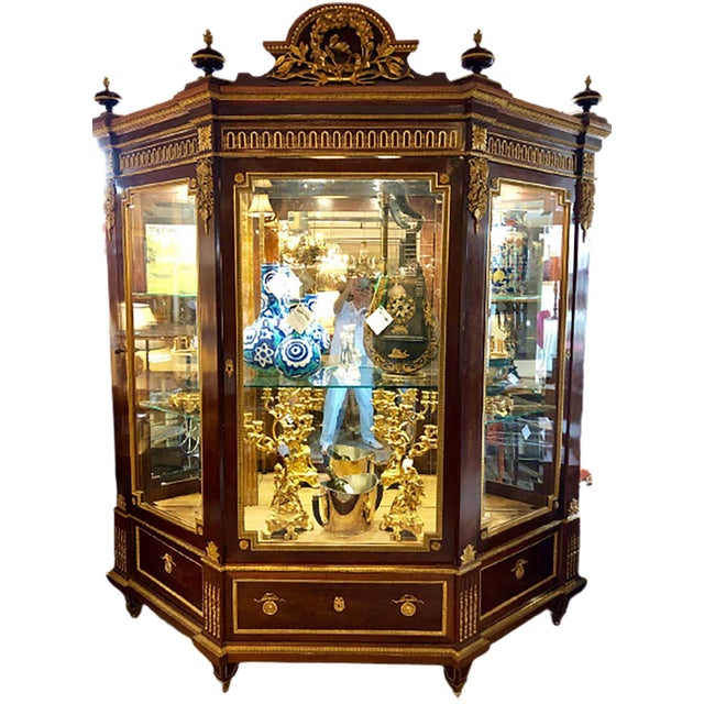 19th century link quality mahogany vitrine cabinet having spectacular bronze mounts stamped Grohe. This Important and...