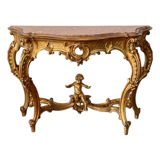 Early 19th Century Baroque Carved & Gilted Walnut Ormolu with Marble Console Table and Cherub For Sale