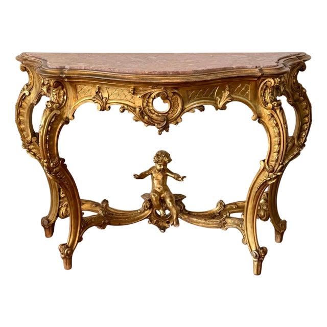 Early 19th Century Baroque Carved & Gilted Walnut Ormolu with Marble Console Table and Cherub For Sale