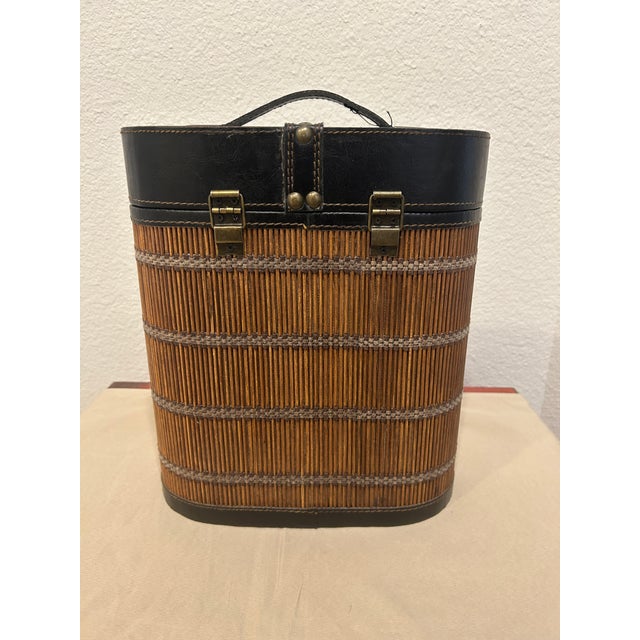 Fabulous vintage wooden wine carrying case featuring pencil reed Bamboo Overlay and Leather top & trim. Circa 1970's. Case...