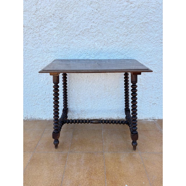 Beautiful English oak side table featuring elegant barley twist legs and matching stretchers, crafted around the early...