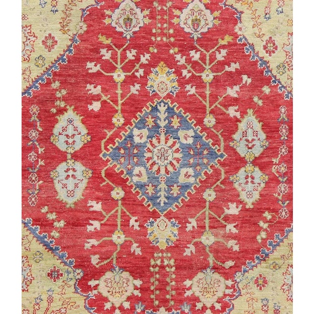 Early 20th Century Antique Turkish Oushak in Yellow Green, Red & Blue With Floral Medallion Design For Sale - Image 4 of 7