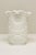 A pressed milk glass celery vase produced by Kemple Glassworks circa 1950s, featuring the distinctive Sunburst—also known...