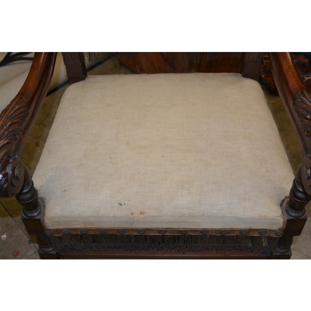 This is a great old wooden arm chair. Sadly it does need re upholstered. The stuffing looks to be straw & wiry hairs,...