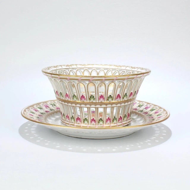 A delicate and intricately worked antique Dresden Porcelain Fruit Basket and Underplate. The form is rare and a technical...
