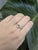 This elegant ring features a 0.8-carat pear-shaped Imperial Topaz from Brazil, measuring 2x4.8mm. Known for its warm,...