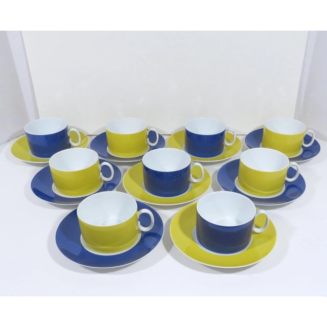 A set of coordinating Thomas Bavarian Porcelain coffee/tea cups & saucers, in modern style. Each cup & saucer is glazed in...