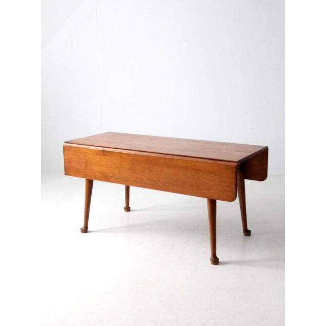 A mid-century Colonial Revival drop-leaf dining table by O’Hearn of Gardner, Massachusetts, crafted in sugar maple. The...