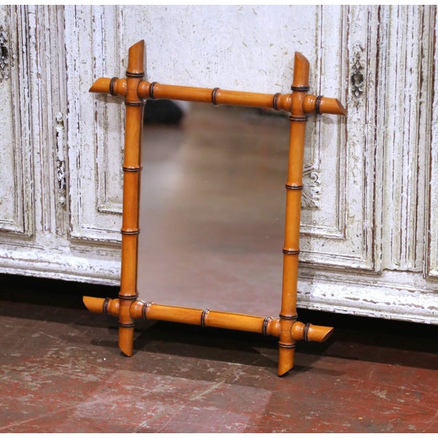 This charming mid-century French faux bamboo wall mirror brings a warm, decorative accent to a powder room, entry,...