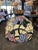 Floral Slag Glass Chandelier with an oval shape. Purple and pink flowers with green leaves. Measures about 16” x 26” and...
