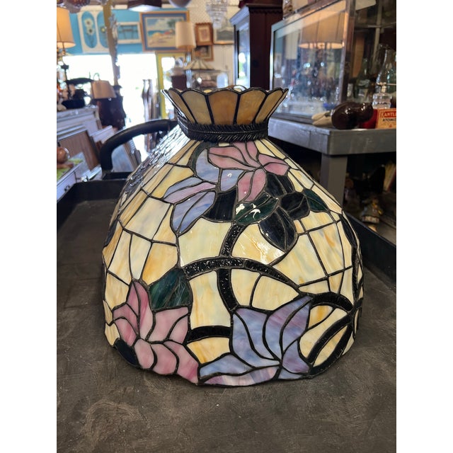 Floral Slag Glass Chandelier with an oval shape. Purple and pink flowers with green leaves. Measures about 16” x 26” and...