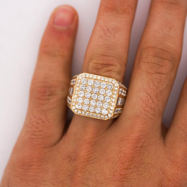 Natural 3 carat total weight round brilliant and baguette diamond cluster statement ring in 14K yellow gold, featuring a...