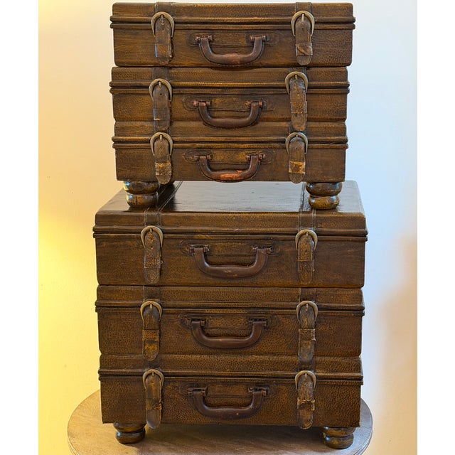 Decorative faux stacked suitcase tables, one slightly larger than the other and the perfect size to fit between club...