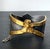 A rare cuff bracelet in gilded and silvered bronze by Parisian art jewller Line Vautrin (1913-1997). The playful piece is...