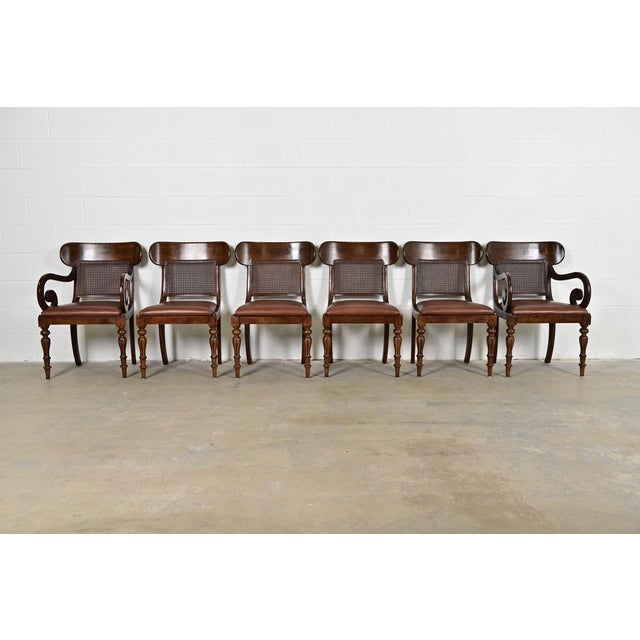 A gorgeous set of six English Regency style dining chairs By Ralph Lauren for Henredon Circa Late 20th Century Carved...