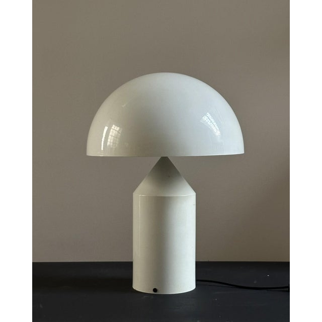 Atollo lamp, designed by Vico Magistretti for Oluce, circa 1970s. Lamp made of white lacquered metal. Light diffusion with...