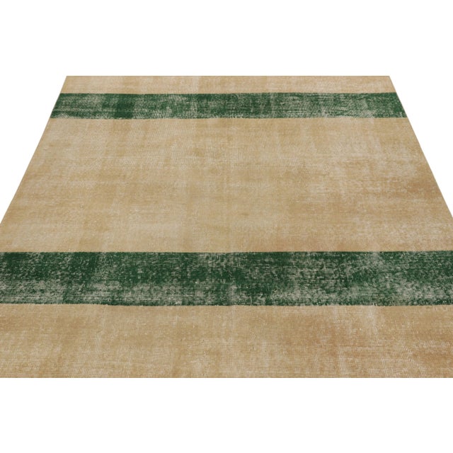 This vintage rug is a 6x8 Turkish distressed piece, made with hand-knotted wool circa mid-20th century. It is an exciting...