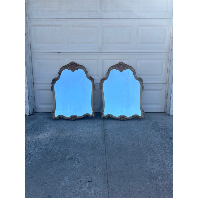 We have a beautiful pair of vintage French Provincial wall mirrors for sale! They feature elegant Rococo Revival styling,...