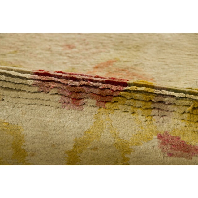 Hand-knotted in wool, this 8x12 antique French Savonnerie carpet originating circa 1920-1929 is a majestic masterpiece in...