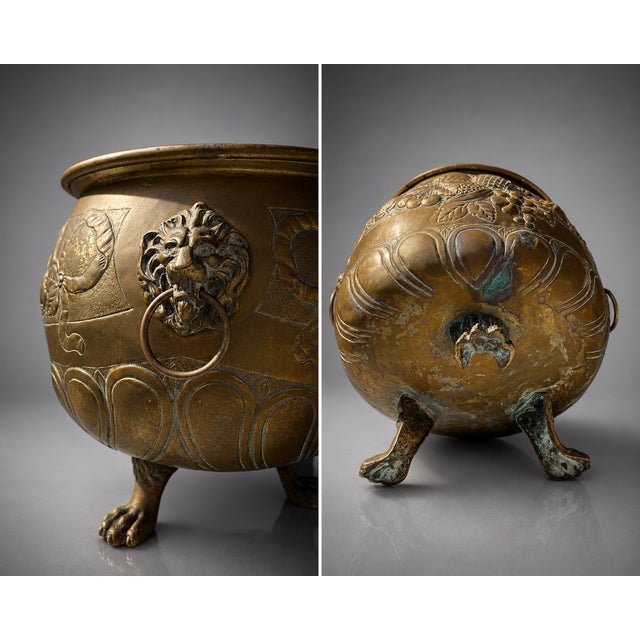 Exceptional antique brass jardinière featuring richly detailed repoussé-style decoration with fruit, florals and scrolling...