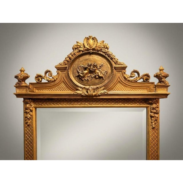 An exceptional French-inspired freestanding tall mirror crafted with a rich gilt wood frame and finished with fine beveled...