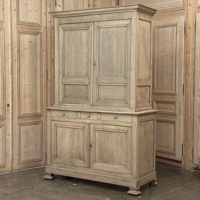 19th Century French Louis Philippe Period Buffet a Deux Corps in Stripped Oak was hand-crafted by master artisans during...