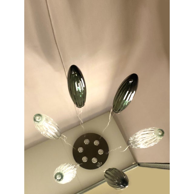 Contemporary composition of "swords" Murano glass in trasparent and petrol-green "Rigadin" ,a traditional working of...