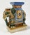 Deep colors of green, blue and browns adorn this vintage ceramic elephant stand, bookend, or decorative piece. Natural age...