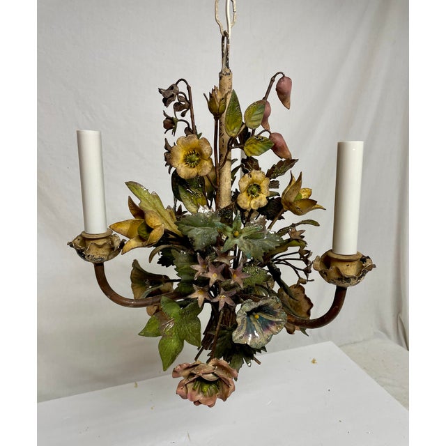 Hollywood Regency tole floral bouquet chandelier. Like a bouquet with many types of multi color flowers and leaves....