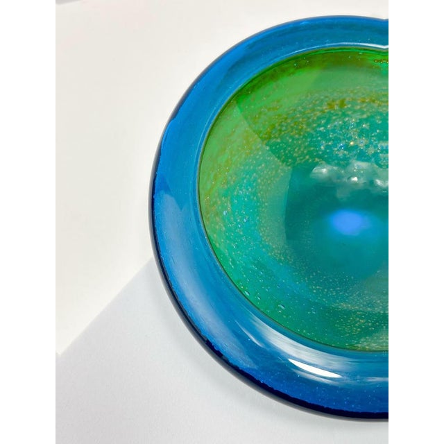 A small round glass bowl crafted in the early 1970s by Michael Harris. This particular piece is one of Harris's early...