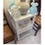 A vintage 1950s Michael Taylor side table painted a clean white showcases the designer's signature style, combining...