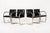 This set of four mid century modern Brno arm chairs by Mies van der Rohe were manufactured by Knoll circa 2015. These...