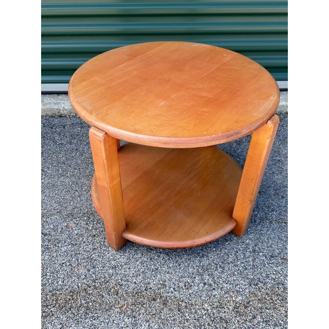 Add a piece of design history to your home with this exceptional (and rare) round side table from the iconic American...