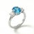 Professional Product Description: This elegant ring features a stunning Blue Topaz gemstone at its center, admired for its...