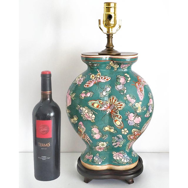 Offering a unique vintage Chinese porcelain pomegranate shaped table lamp with butterflies, fruits and flowers, circa Mid...