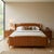 Walnut veneered wooden bed. In good condition. This piece is attributed to the mentioned designer/maker. It has no...