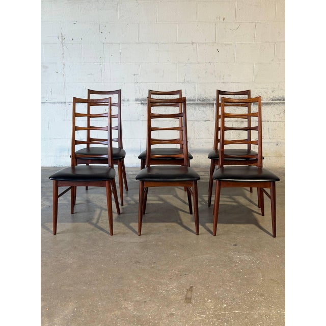 These elegant dining chairs feature a striking tall sculpted ladder-back profile with gracefully tapered legs. The refined...