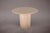 Introducing our exquisite Round Travertine Table, featuring vertically striped edges and a single conical leg....