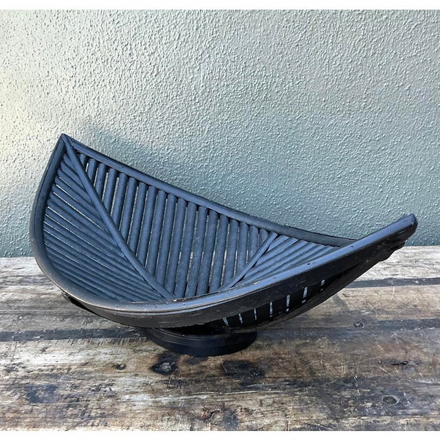 Elevate your tabletop with this striking Mid-Century Modern large rattan leaf bowl, a masterful fusion of organic form and...