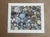 An intimate and calming composition, this giclée print features a natural arrangement of smooth river stones in soft,...
